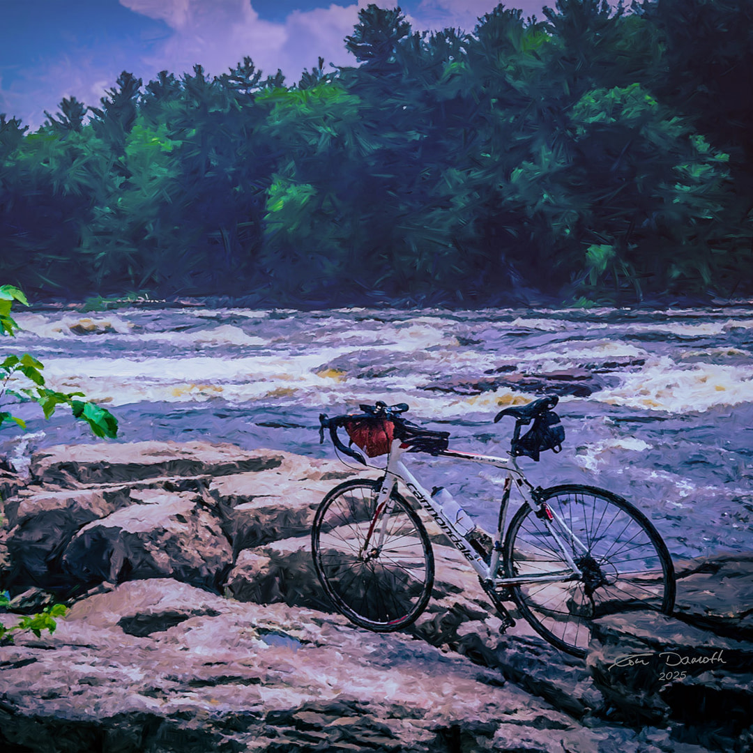 A Cannondale bicycle parked on a bedrock outcrop with foaming rapids of the Wisconsin River in the background.